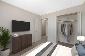 A modern living room with a flat screen TV mounted on the wall.